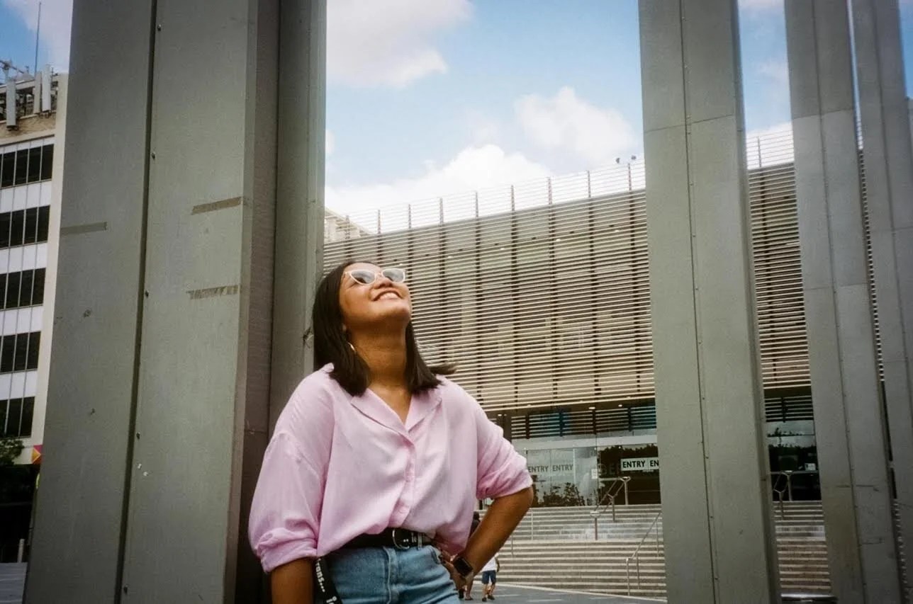 Jasmine looks up at the sky and smiles (Credit: @saturate_syd)
